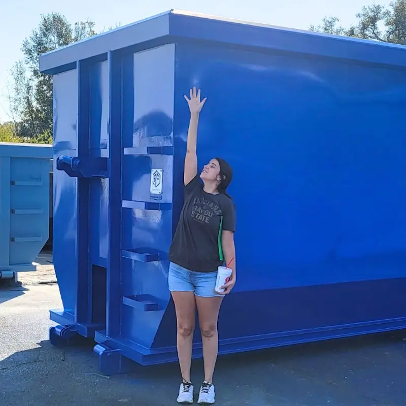 holly attuso with tall roll off dumpster